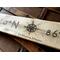 A personalized wedding sign. It shows the location of where you got married with the longitude-latitude coordinates.  